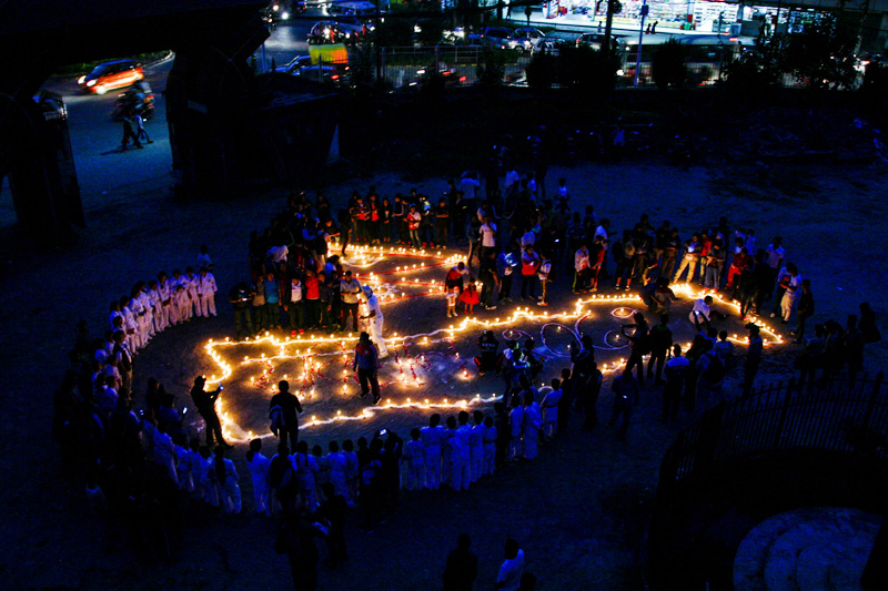 Nepal National and International Players Association light candles at the Dasharath Stadium welcoming the adoption of new constitution, on Friday, September 18, 2015. Photo: THT