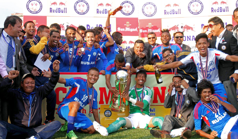 Players and officials of Three Star Club take photo with winner's trophy during the prize distribution ceremony of the Red Bull National League match at ANFA Complex in Lalitpur on Saturday. Photo: Udipt Singh Chhetry