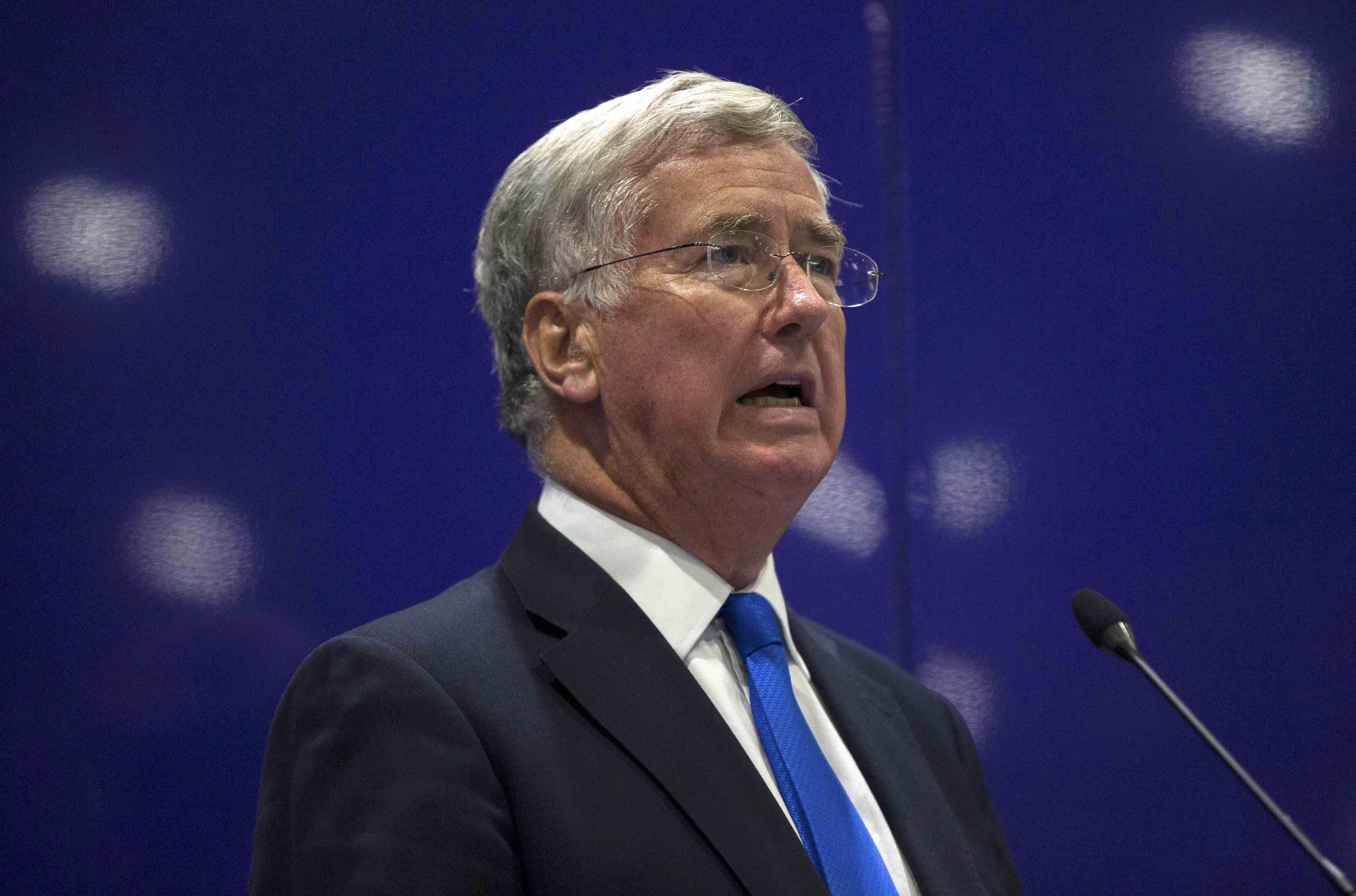 Britain's Secretary of Defence Michael Fallon delivers a speech at the Defence and Security Equipment International trade show in London, Britain September 16, 2015. REUTERS/Neil Hall