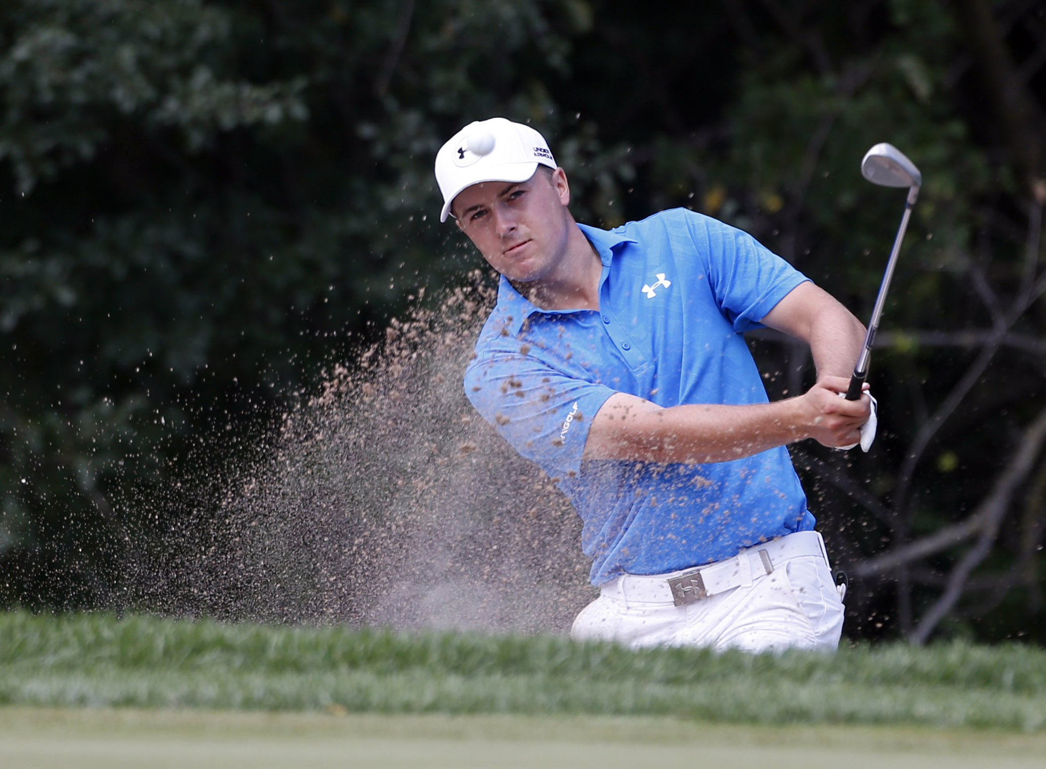 Sep 17, 2015; Lake Forest, IL, USA; PGA golfer Jordan Spieth hits out of a sand trap on the 6th hole during the first round of the BMW Championship at Conway Farms Golf Club. Mandatory Credit: Brian Spurlock-USA TODAY Sports