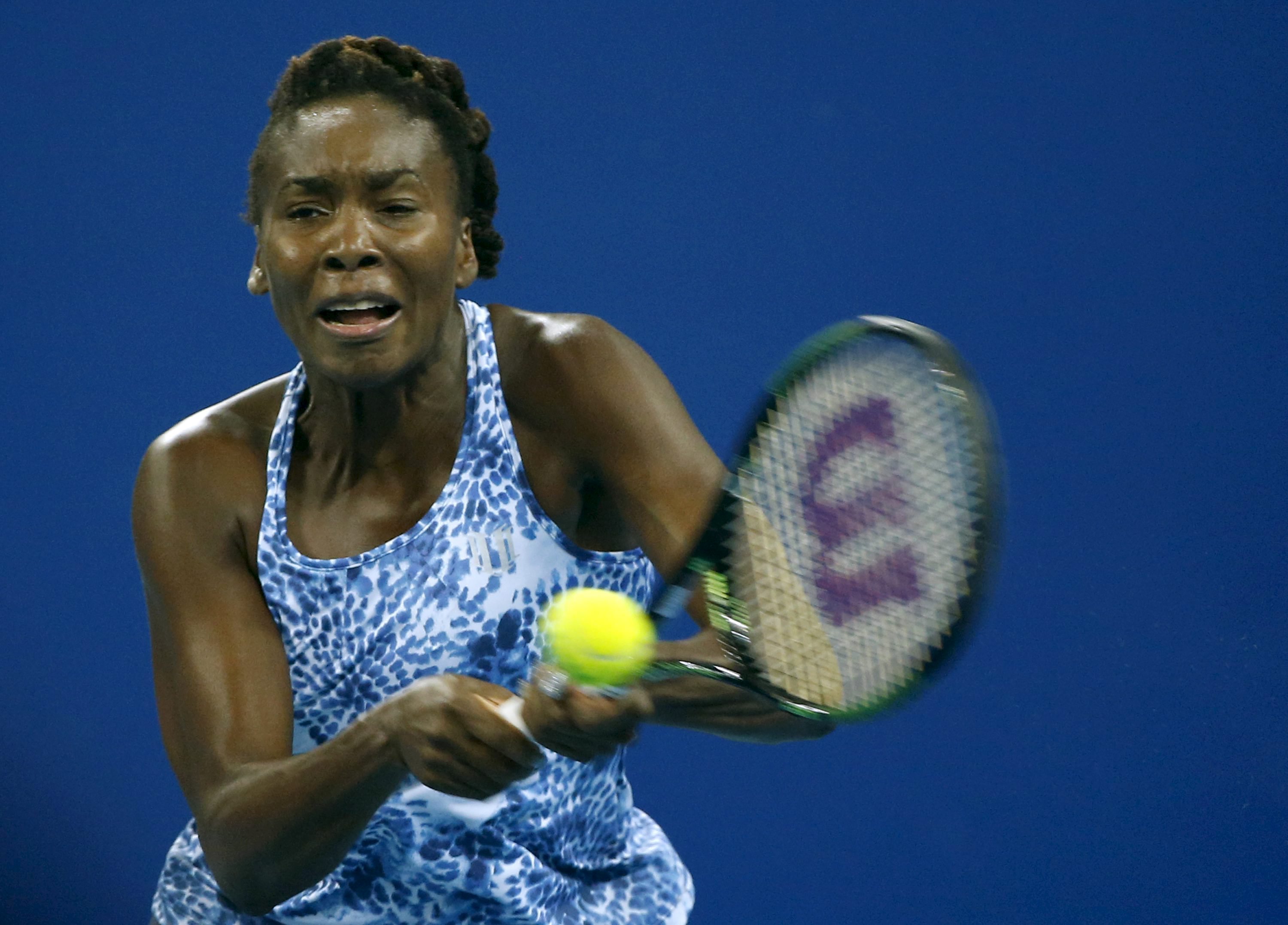 Venus Williams of U.S. hits a return against Ana Ivanovic of Serbia during their women's singles match at the China Open tennis tournament in Beijing, China, October 6, 2015.    REUTERS/Kim Kyung-Hoon