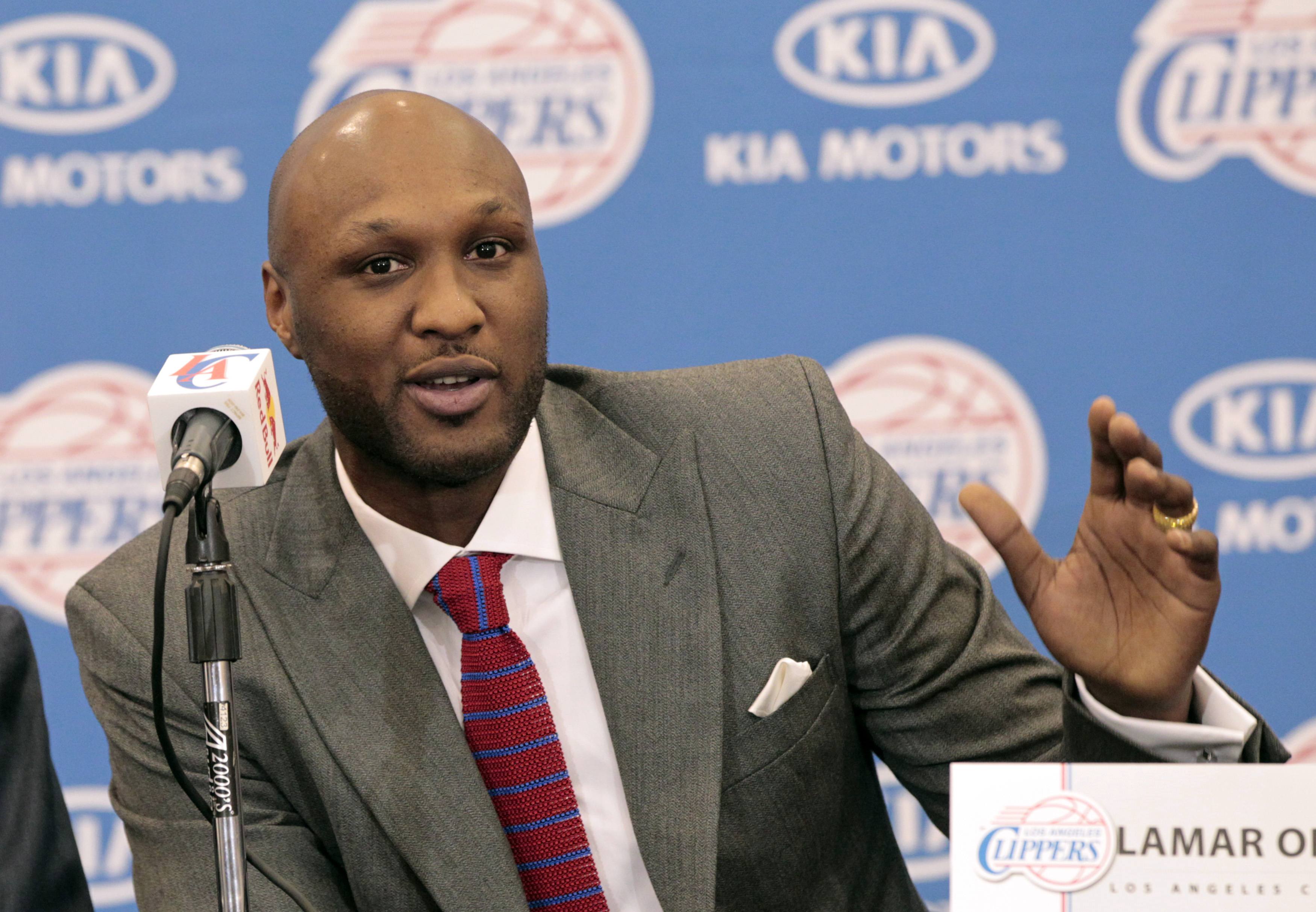 Basketball player Lamar Odom speaks at a news conference announcing his acquisition by the Los Angeles Clippers in Los Angeles, California in this July 2, 2012 file photo. REUTERS/Mario Anzuoni/Files