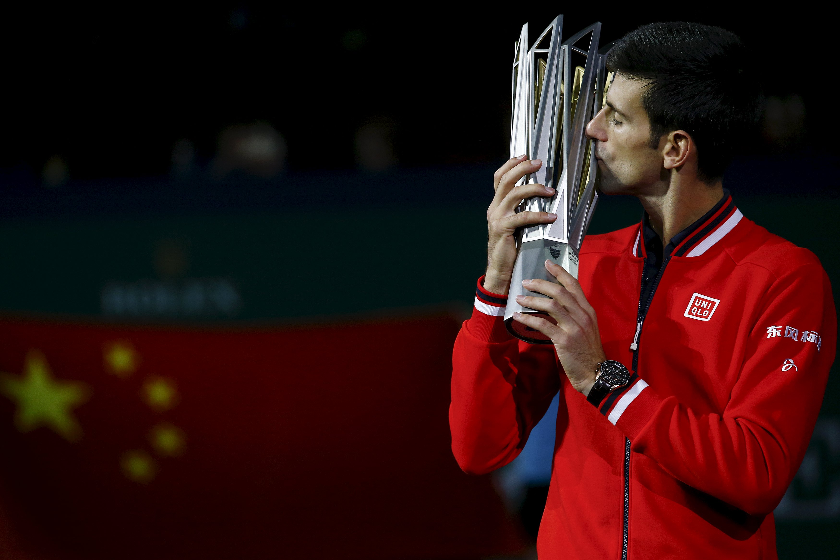 Novak Djokovic of Serbia kisses the trophy after winning the men's singles final match against Jo-Wilfried Tsonga of France at the Shanghai Masters tennis tournament in Shanghai, China, October 18, 2015.  REUTERS/Damir Sagolj