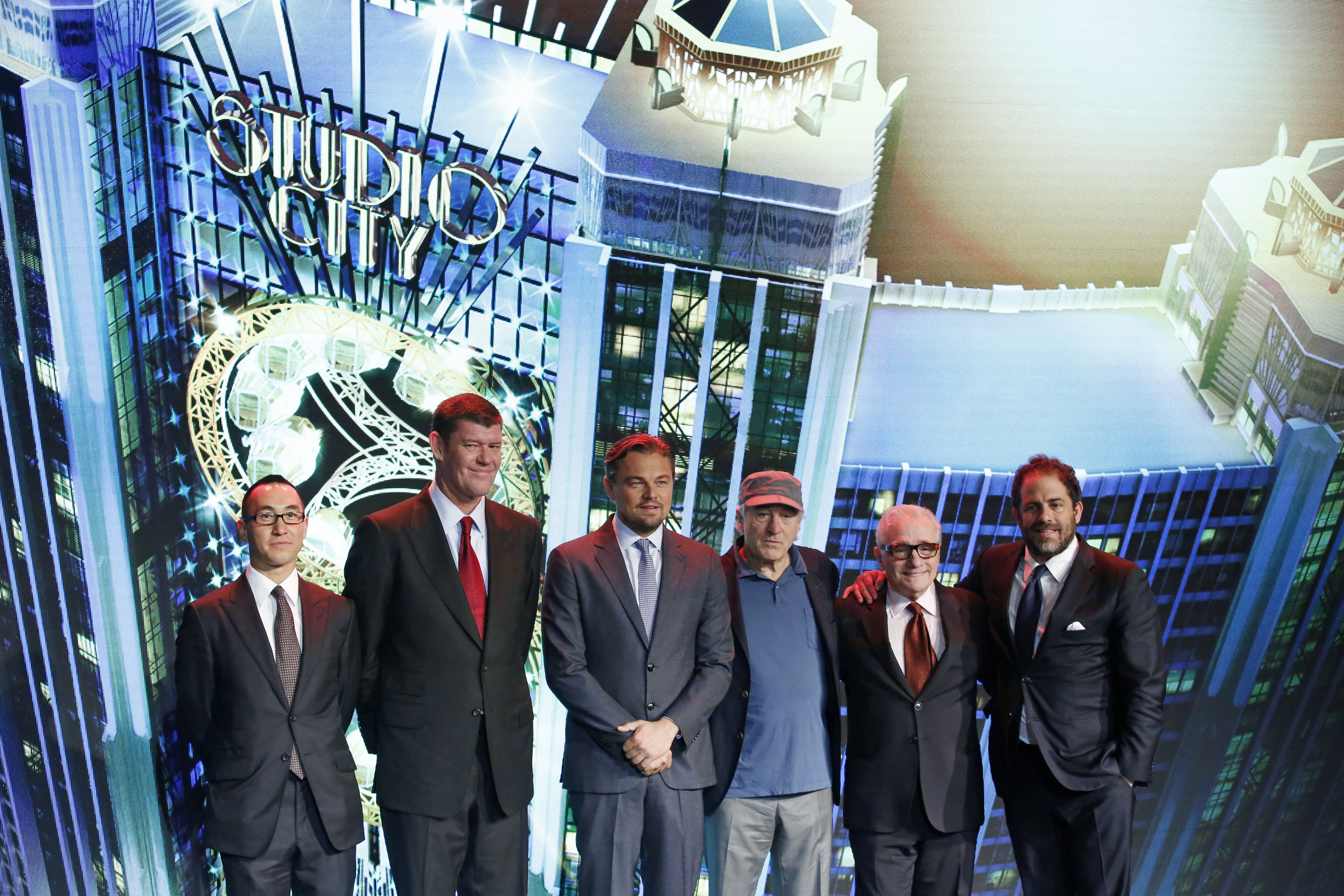 From left, Melco Crown Entertainment's co-chairman and chief executive officer Lawrence Ho and co-chairman James Packer pose with film stars Leonardo DiCaprio, Robert De Niro, director Martin Scorsese and producer Brett Ratner during a launch ceremony of the Studio City project in Macau, Tuesday, Oct. 27, 2015. China's world-beating gambling hub is getting a taste of Hollywood glamor as its newest casino resort makes its debut on Tuesday with a glitzy grand opening that masks turmoil behind the scenes. (AP Photo/Kin Cheung)