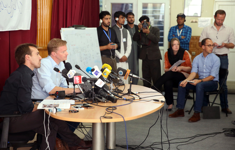 The general director of medical charity, Medecins Sans Frontieres (MSF), Christopher Stokes, right, and MSF's Country Representative for Afghanistan, Guilhem Molinie, left, listen to a question during a press conference at their office, in Kabul, Afghanistan, Thursday, Oct. 8, 2015. Medecins Sans Frontieres, also known as Doctors Without Borders continued Thursday to press its demand for an independent investigation of the tragic U.S. airstrike that hit a hospital run by the medical charity in northern Afghanistan, killing 22 people. (AP Photos/Massoud Hossaini)