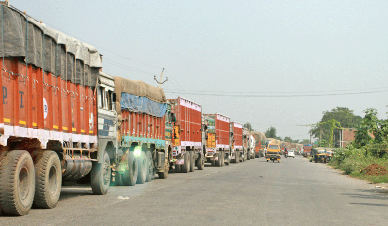 Cargo trucks heading to Nepal have been left stranded at Nautanwa of Uttar Pradesh for over a month. Photo: RSS