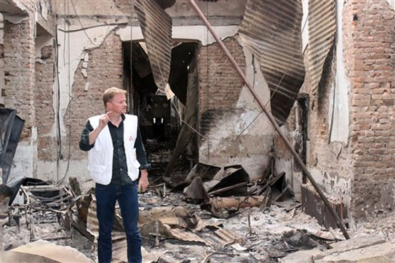 Christopher Stokes, the general director of the medical charity, Doctors Without Borders, which is also known by its French abbreviation MSF, stands amid the charred remains of the organization's hospital, after it was hit by a US airstrike in Kunduz, Afghanistan on Friday, October 16, 2015. Photo: AP