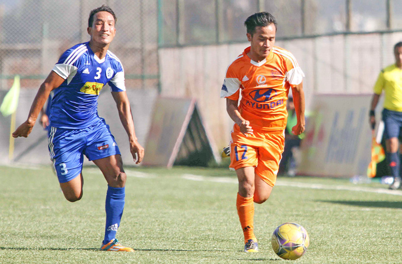 Bishal Rai (right) of Manang Marshyangdi Club dribbles the ball against Dilan Loktam of Jhapa-XI during their Red Bull National League match at the ANFA Complex in Lalitpur on Wednesday. Photo: Udipt Singh Chhetry/THT