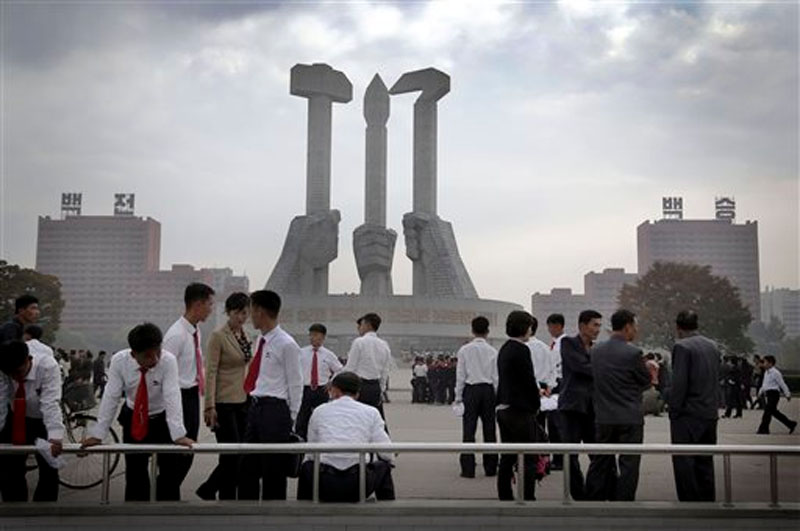 North Koreans gather at a monument built 10 years ago to honor the founding of the Workers' Party of North Korea, in Pyongyang, North Korea on October 8, 2015. Photo: AP