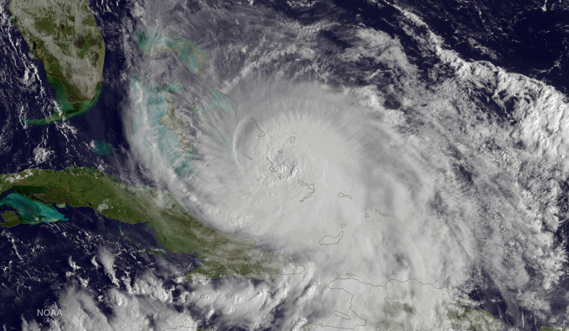 This satellite image taken Friday, Oct. 2, 2015 at 8:45 a.m. EDT, and released by the National Oceanic and Atmospheric Administration (NOAA), shows Hurricane Joaquin of the Bahamas. The Category 4 storm ripped off roofs, uprooted trees and unleashed heavy flooding as it hurled torrents of rain across the eastern and central Bahamas on Friday, and the U.S. Coast Guard said it was searching for a cargo ship with 33 people aboard that went missing during the storm.  (NOAA via AP)