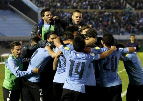 Uruguay's players celebrate after scoring a goal against Colombia during their 2018 World Cup qualifying soccer match at the Centenario stadium in Montevideo, Uruguay, October 13, 2015. REUTERS/Andres Stapff