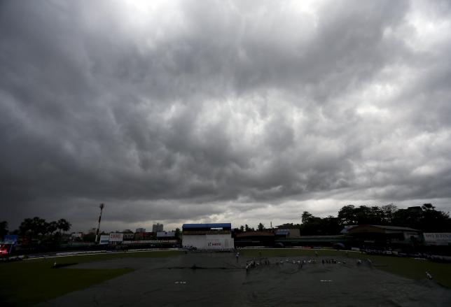 Dark clouds gather overhead as the match was stopped due to rain on the third day of the second test cricket match between Sri Lanka and West Indies in Colombo October 24, 2015. REUTERS/Dinuka Liyanawatte