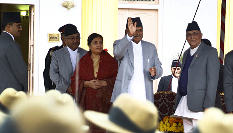 Outgoing President Ram Baran Yadav greets as he leaves the stage after newly elected President Bidya Bhandari was administered the oath of office at the Sheetal Niwas in Kathmandu on Thursday, October 29, 2015. Photo: Skanda Gautam