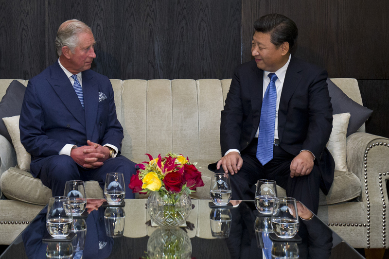 Britain's Prince Charles, left, sits with Chinese President Xi Jinping, right, at a hotel in central London, Tuesday, Oct. 20, 2015, on the first official day of a state visit. Chinese President Xi Jinping prepared to address Britain's Parliament and dine with Queen Elizabeth II Tuesday as he began a state visit that is intended to cement close economic ties between the two countries u0097 but risks being overshadowed by concerns over Beijing's growing economic clout in Britain. Photo: AP