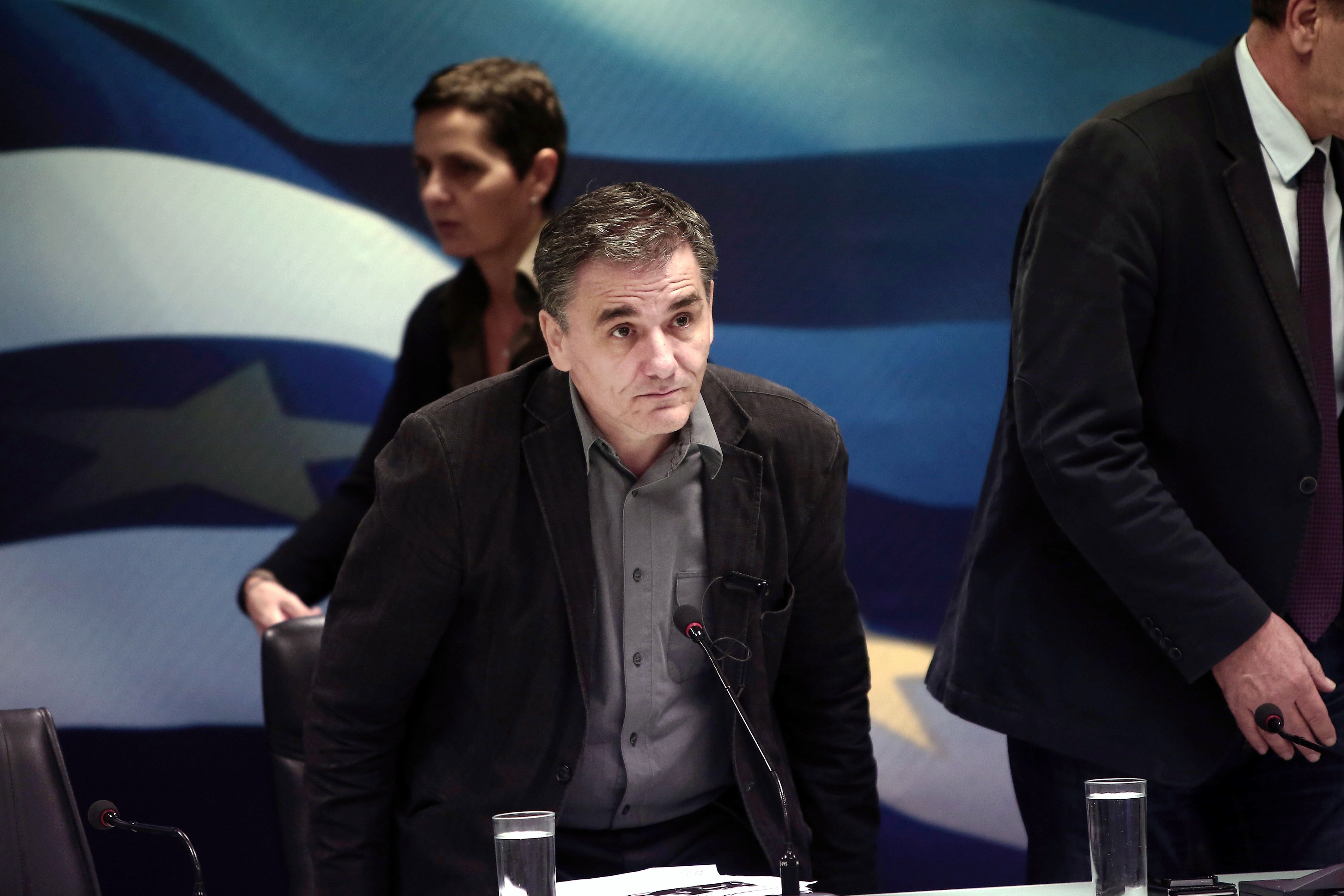 Greek Finance Minister Euclid Tsakalotos arrives for a press conference at the Ministry in Athens on November 17, 2015. Greece announced it has struck a deal with its international creditors to unblock some 12 billion euros in much-needed bailout loans. Photo: AFP