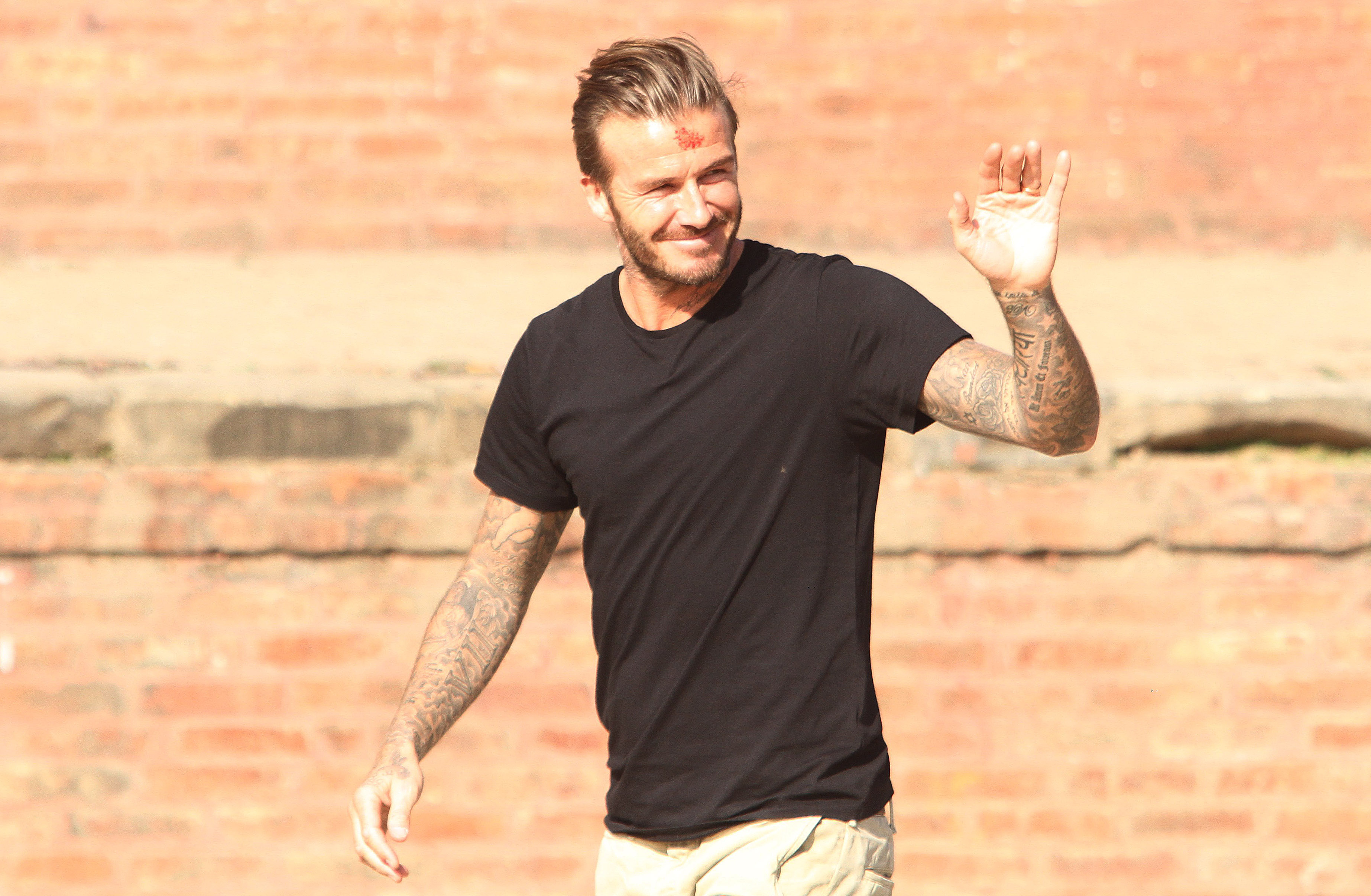 David Beckham waiving hand to the fans at the Bhaktapur Durbar Square in Bhaktapur on Friday, November 06, 2015. Photo: Mahesh Acharya