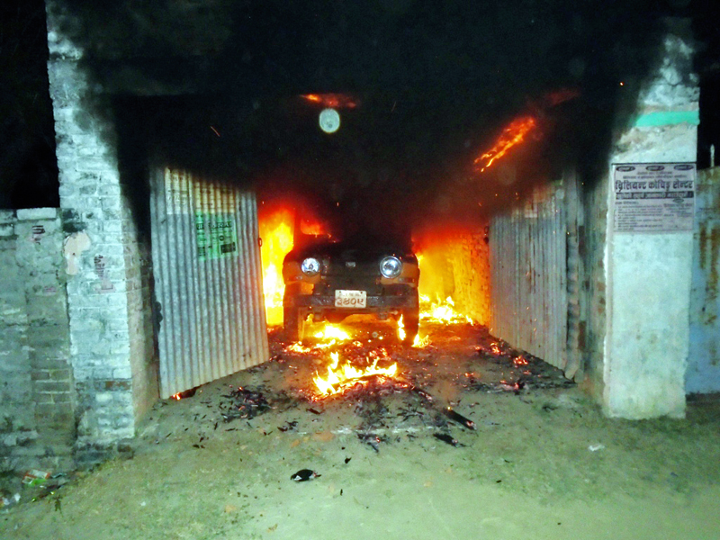 A jeep parked in the premises of Rajbiraj-based Survey Office set in fire by the agitators in Saptari on Monday, November 23, 2015. Photo: THT Online