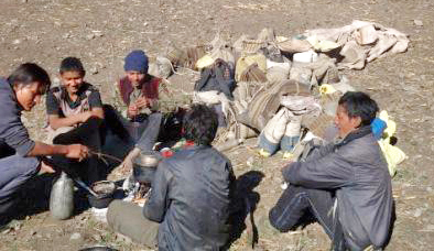 Locals migrating to lower land from hilly areas to avoid the cold, at Bahrabisa, Bajura, on Wednesday. Photo: THT