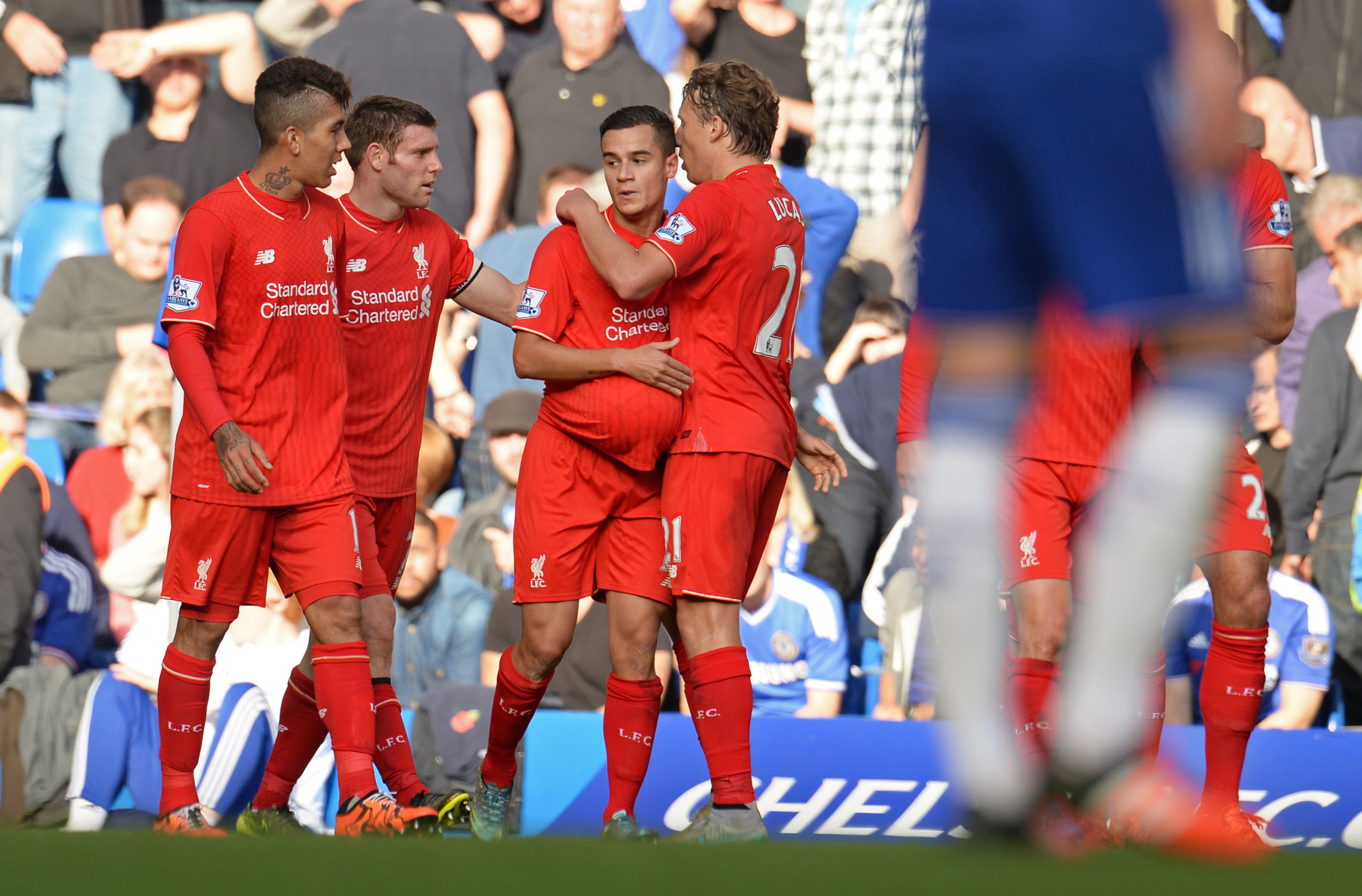 Philippe Coutinho celebrates with team mates after scoring the first goal for Liverpool. Photo: Reuters