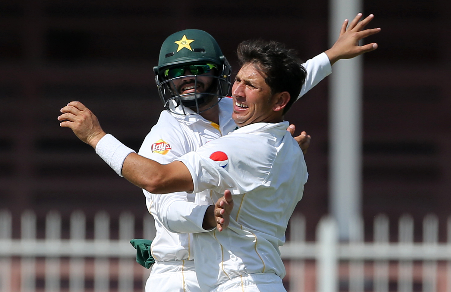 Cricket - Pakistan v England - Third Test - Sharjah Cricket Stadium, United Arab Emirates - 2/11/15nPakistan's Yasir Shah (R) celebrates taking the wicket of England's Alastair Cook (not pictured)nAction Images via Reuters / Jason O'BriennLivepic