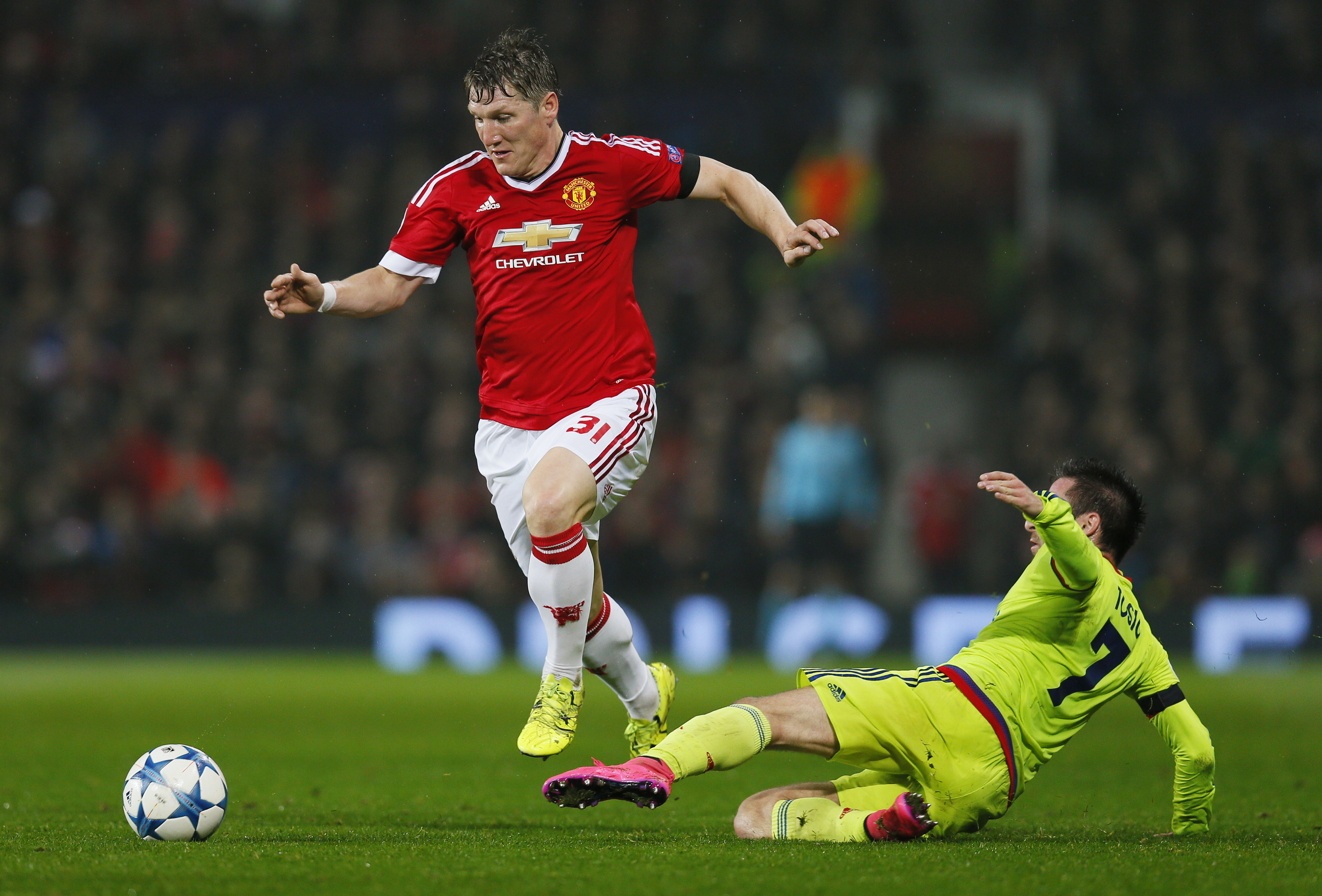 Manchester United's Bastian Schweinsteiger and CSKA Moscow's Zoran Tosic in action during UEFA Champions League game at Old Trafford on March 11, 2015. Photo: Reuters