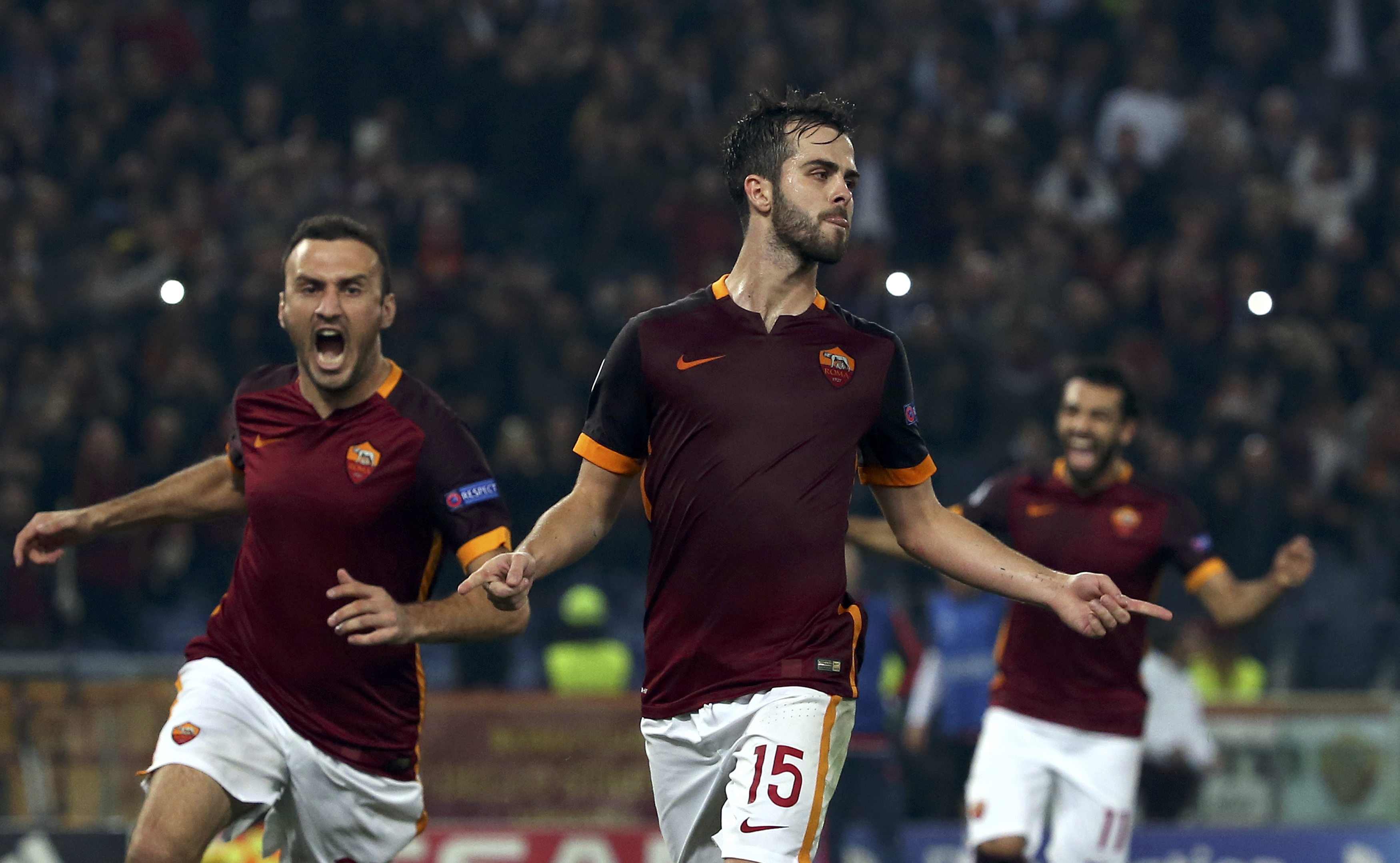 AS Roma's Miralem Pjanic (C) celebrates after scoring against Leverkusen's during their Champions League Group E soccer match at Olympic stadium in Rome, Italy, November 4, 2015. REUTERS/Alessandro Bianchi