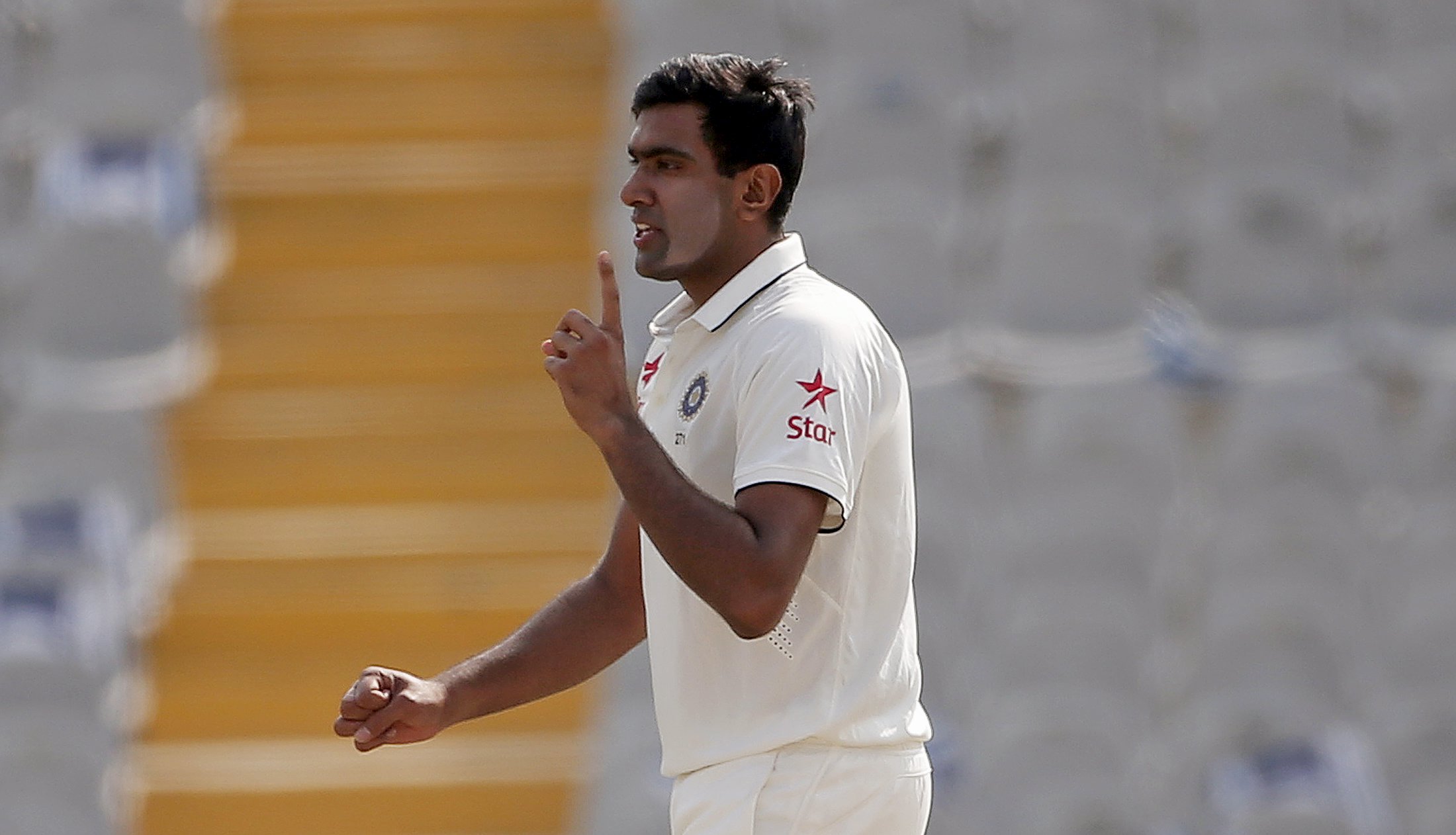 India's Ravichandran Ashwin celebrates after dismissing South Africa's Dean Elgar (not pictured) during the second day of their first cricket test match, in Mohali, India, November 6, 2015. REUTERS/Adnan Abidi