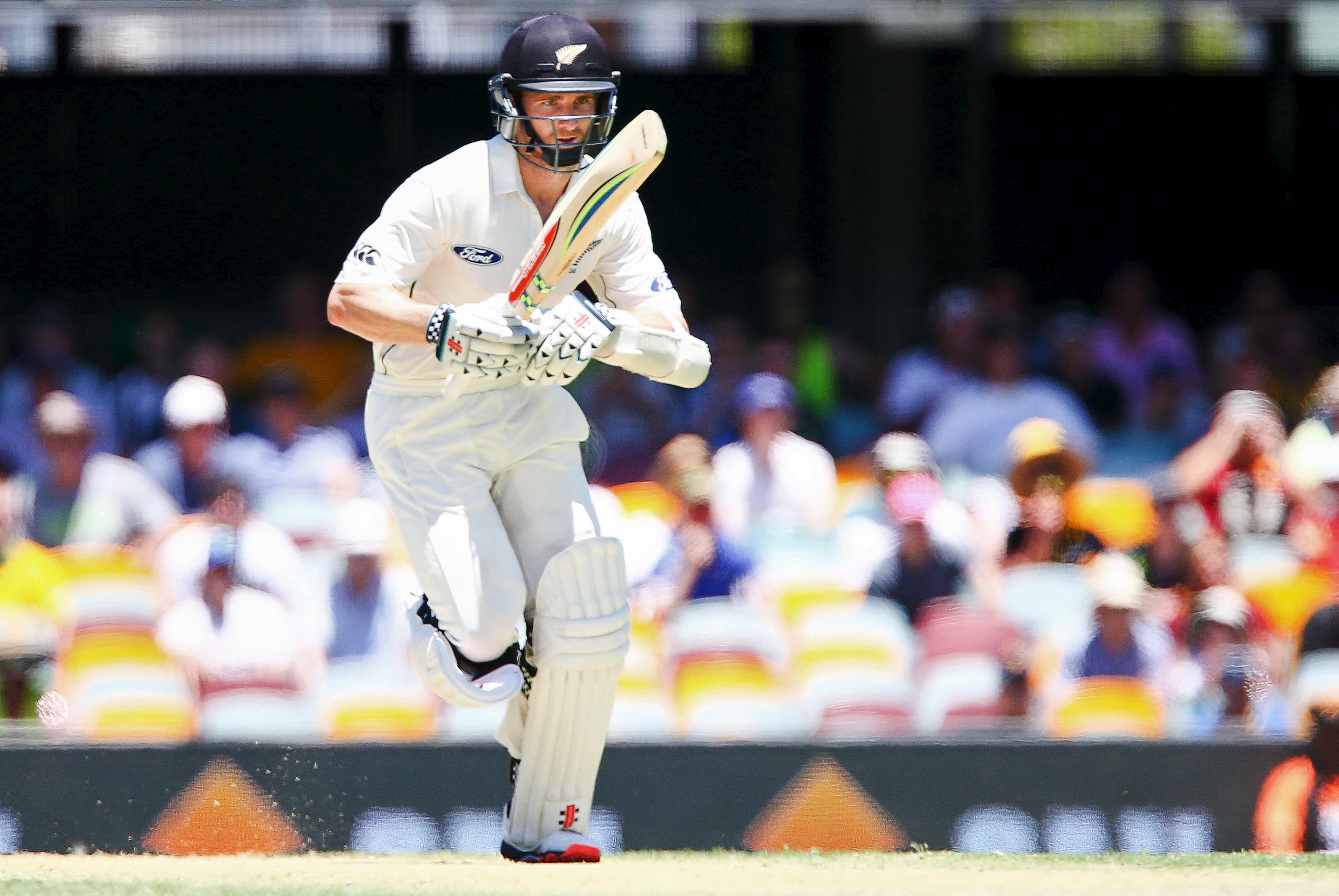 New Zealand batsman Kane Williamson runs for two to get his century, during the first cricket test match between Australia and New Zealand in Brisbane November 7, 2015. REUTERS/Patrick Hamilton