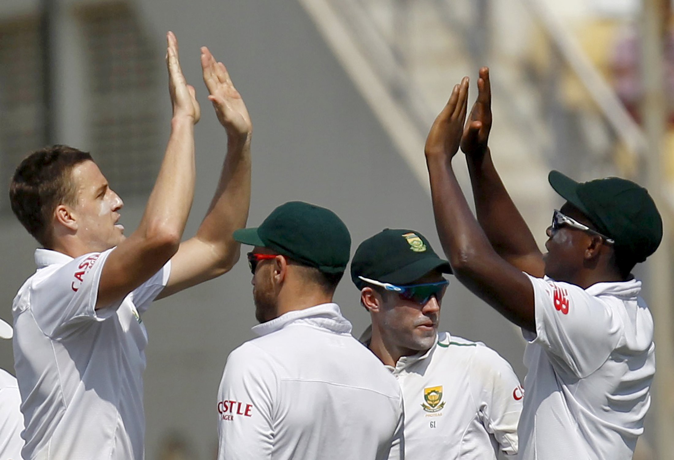 South Africa's Morne Morkel (L) celebrates with his teammates after taking the wicket of India's Ajinkya Rahane (not pictured) on the first day of their third test cricket match in Nagpur, India, November 25, 2015.  REUTERS/Amit Dave
