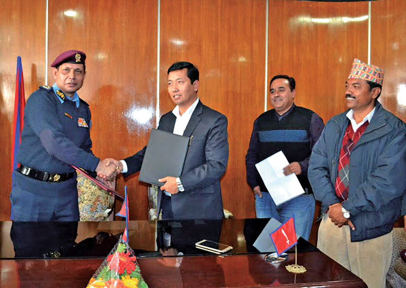 (Left) AIGP Bigyan Raj Sharma shaking hands with Chief Executive of Kathmandu nMetropolitan City Rudra Singh Tamang after signing the MoU, in Kathmandu, on Sunday. Photo: RSS