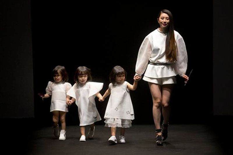 Models present creations from the Hello Kitty and My Melody Comme Tu Es parent-child outfit collection during the China Fashion Week in Beijing on October 31, 2015. File photo: AP