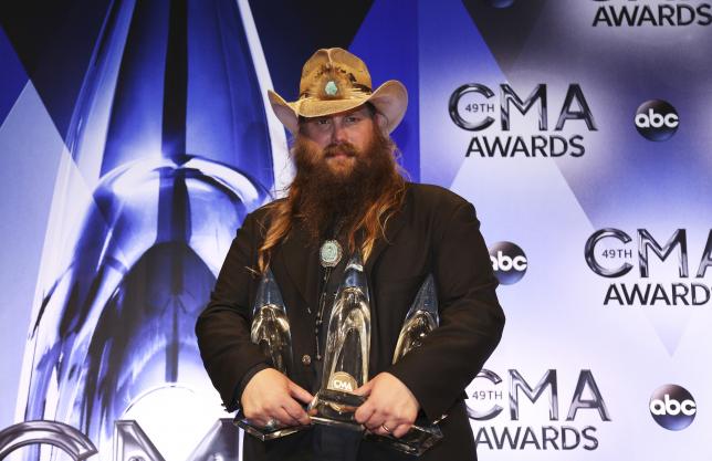Musician Chris Stapleton poses backstage with his awards for Male Vocalist of the Year, New Artist of the Year and Album of the Year for Traveller during the 49th Annual Country Music Association Awards in Nashville, Tennessee November 4, 2015.  REUTERS/Jamie Gilliam