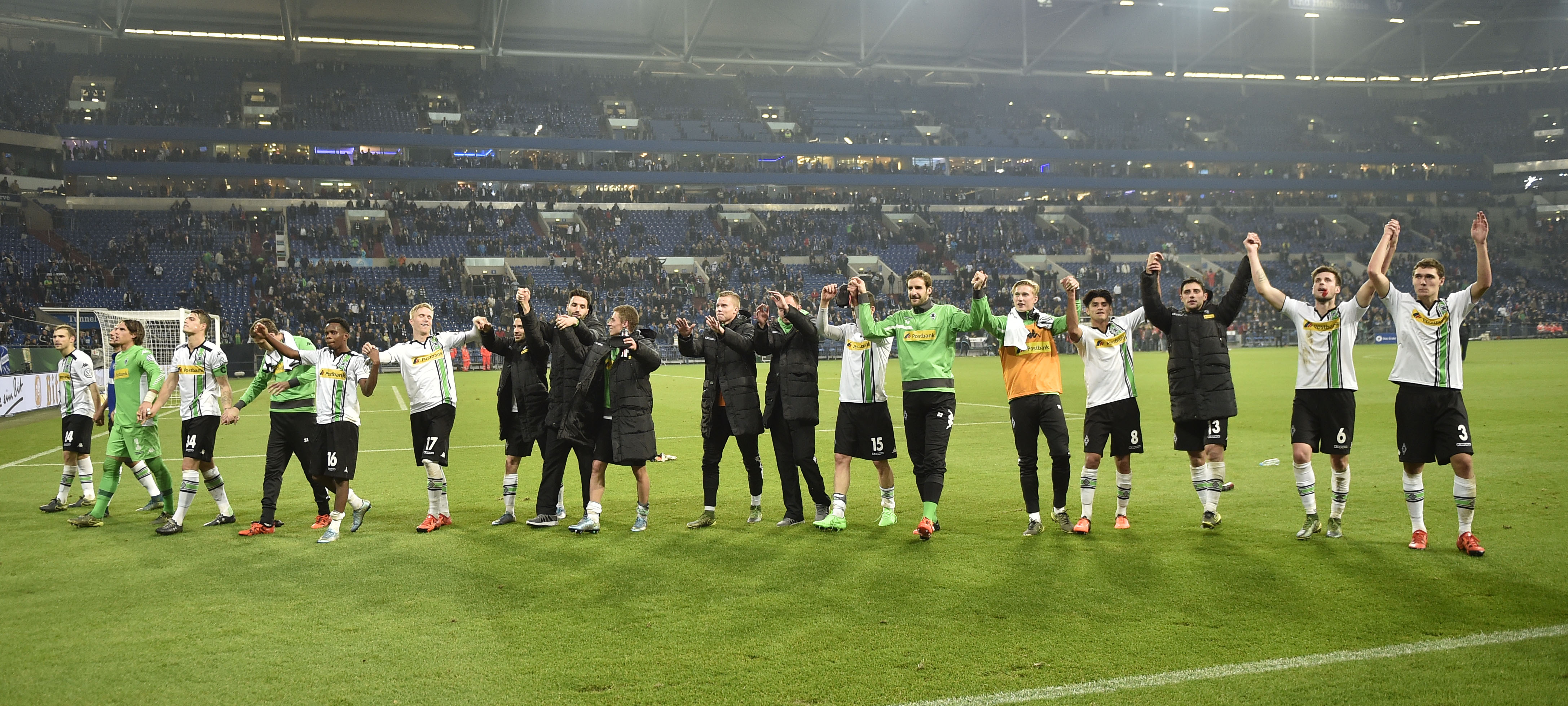 Moenchengladbach's team celebrates winning the German soccer cup second round match between FC Schalke 04 and Borussia Moenchengladbach  in Gelsenkirchen, Germany, Wednesday, Oct. 28, 2015. Schalke was defeated by Moenchengladbach with 0-2. (AP Photo/Martin Meissner)