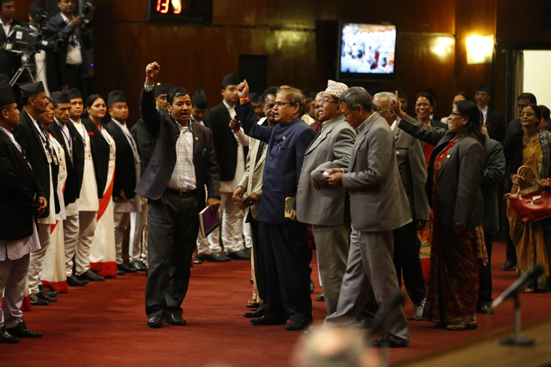 Lawmakers of the Madhes-centric parties chant slogans demanding fulfillment of their demands, of accusing the government of not paying serious attention to demands of the protesting parties during the Parliament meeting, in Kathmandu, on Sunday, November 8, 2015. Lawmakers of four parties, affiliated with the agitating United Democratic Madhesi Front, obstructed the business at Parliament on Sunday. After the obstruction, Speaker Onsari Gharti adjourned the House meeting till 3 pm tomorrow. Photo: Skanda Gautam