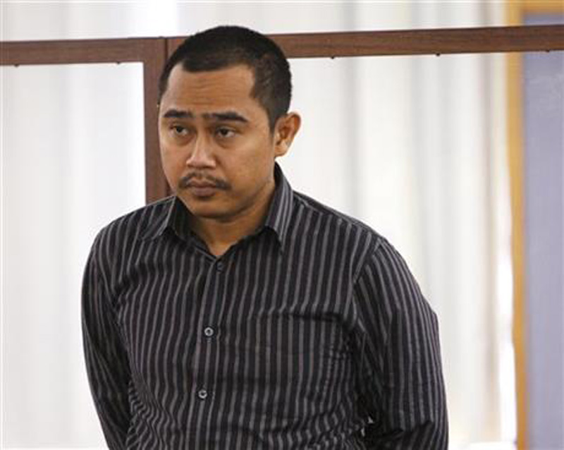 In this Oct. 28, 2014 file photo, Malaysian military officer Muhammad Rizalman Ismail stands in the dock at a court hearing in Wellington, New Zealand. The Malaysian military officer who was extradited to New Zealand after earlier leaving the country under the protection of diplomatic immunity pleaded guilty Monday, Nov. 30, 2015, to indecent assault. Photo: AP