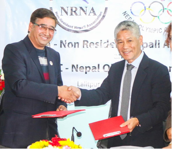 NOC Chairman Jivan Ram Shrestha and NRNA President Shesh Ghale signed the agreement at a programme held at the NOC building, on Sunday, November 29, 2015. Photo: NRNA