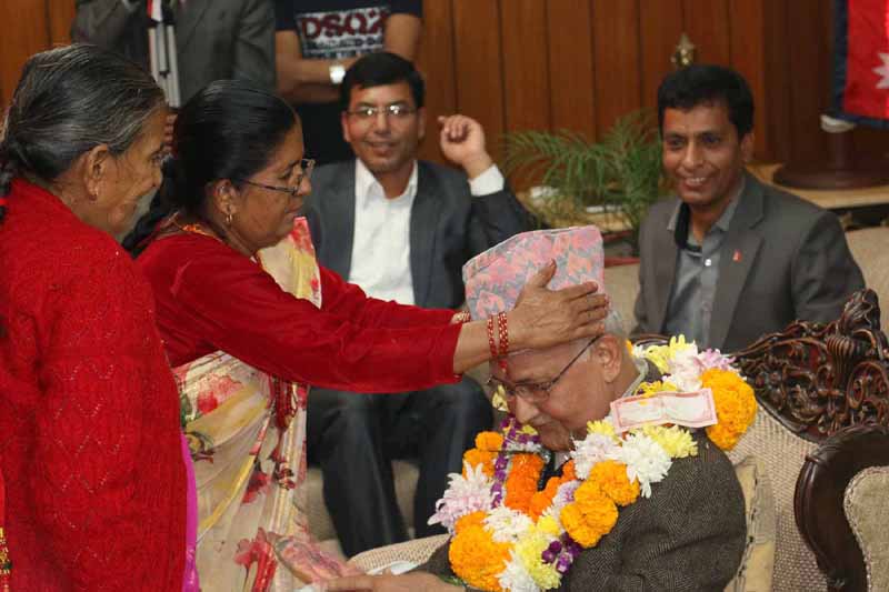 Prime Minister KP Sharma Oli receives Bhaitika from his sisters, on the occasion of Bhaitika under the Tihar festival, at his official residence in Baluwatar, on Friday, November 13, 2015. Photo: RSS