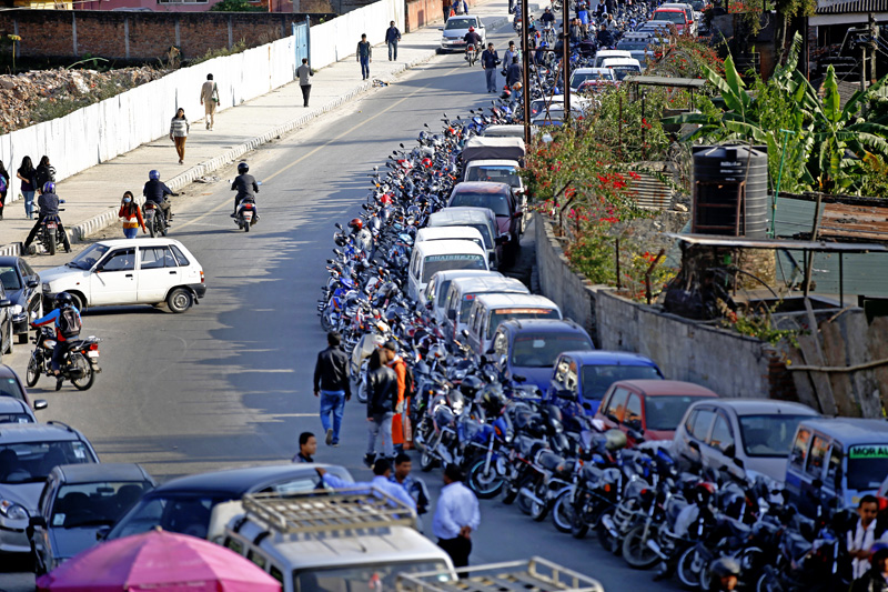 Motorists leave their vehicles to queue for petrol for the next day near a petrol station in Bhadrakali, Kathmandu on Wednesday. Nepal signed a deal last week with China to import petroleum products, its embassy in Beijing said, as the Himalayan nation tries to boost supplies to deal with a deepening fuel crisis. PHOTO/SKANDA GAUTAM