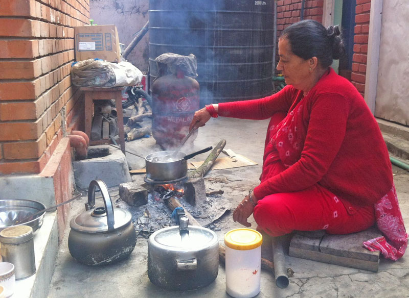 In this photograph that Nepali Congress leader Ram Chandra Paudel posted on Facebook, his wife Sabita Paudel is seen making tea on firewood at her backyard. 