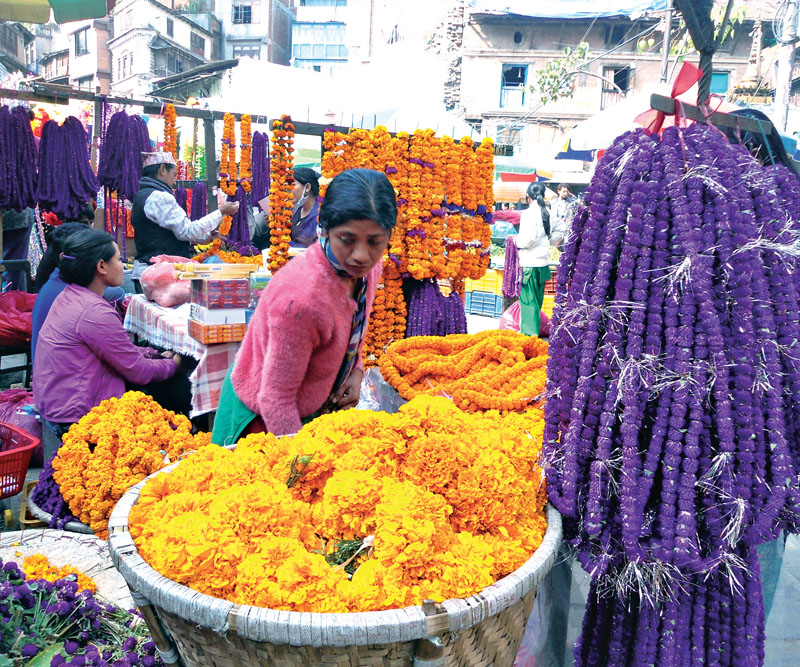 Roadside vendors selling flower garlands for the Tihar festival in Ason nBazaar, Kathmandu, on Sunday.