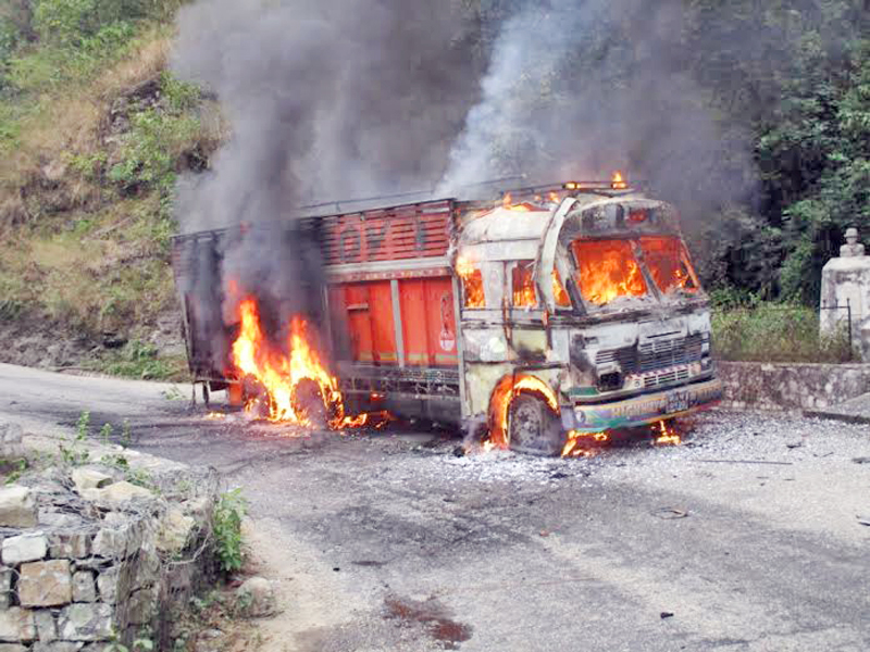 A truck set ablaze by protestors of Netra Bikram Chad-led CPN Maoist  for defying strike in Dhading district. Photo: THT