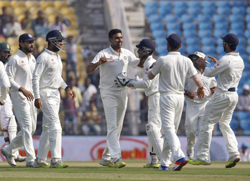 India's Ravichandran Ashwin (4th L) celebrates with his team mates after taking the wicket of South Africa's Dean Elgar (unseen) during the second day of their third test cricket match in Nagpur, India, November 26, 2015.nPhoto: Reuters