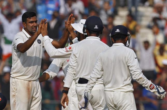 India's Ravichandran Ashwin (L) celebrates with teammates after taking the wicket of South Africa's Dane Vilas during the third day of their third test cricket match in Nagpur, India, November 27, 2015. REUTERS/Amit Dave