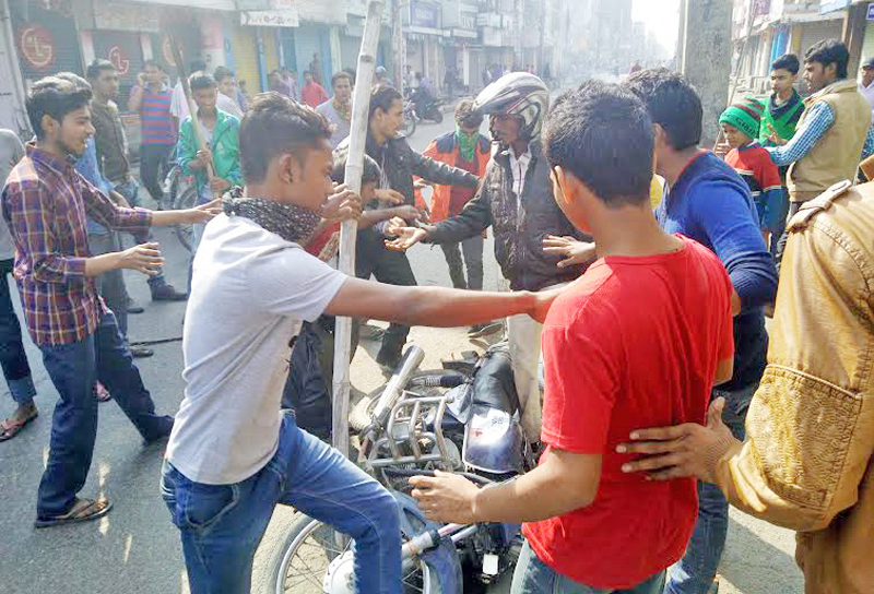Cadres of the United Democratic Madhesi Front (UDMF) vandalising a motorcycle at Maisthan of Birgunj in Parsa district, on Friday, November 20, 2015. Photo: Ram Sarraf