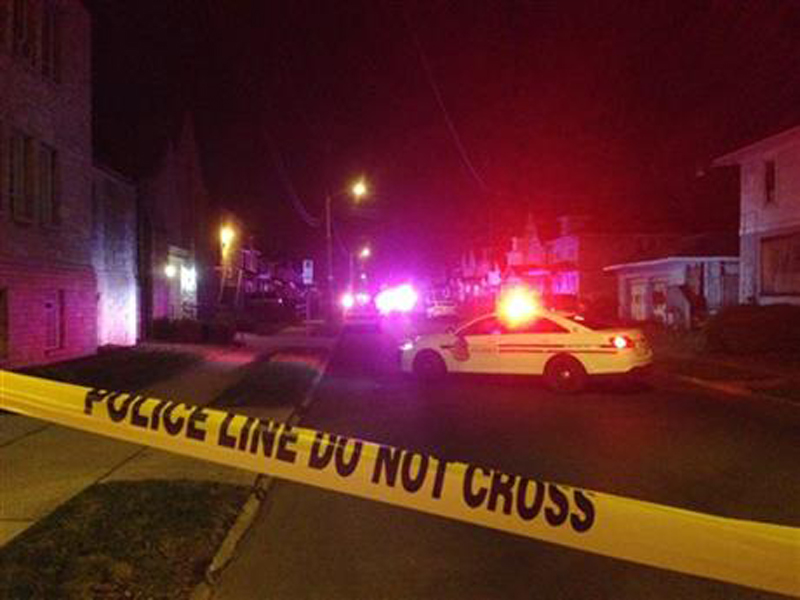 Police block off an area after a fatal shooting on Monday, Nov. 23, 2015, in Columbus, Ohio. The suspect was shot by officers after a short chase outside the house where the shootings happened, Columbus police said. Photo: AP