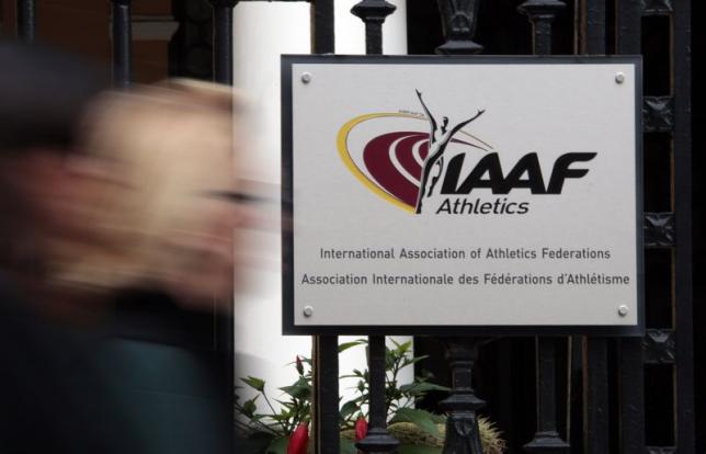 A woman walks past the IAAF (The International Association of Athletics Federations) headquarters in Monaco November 4, 2015.   REUTERS/Eric Gaillard