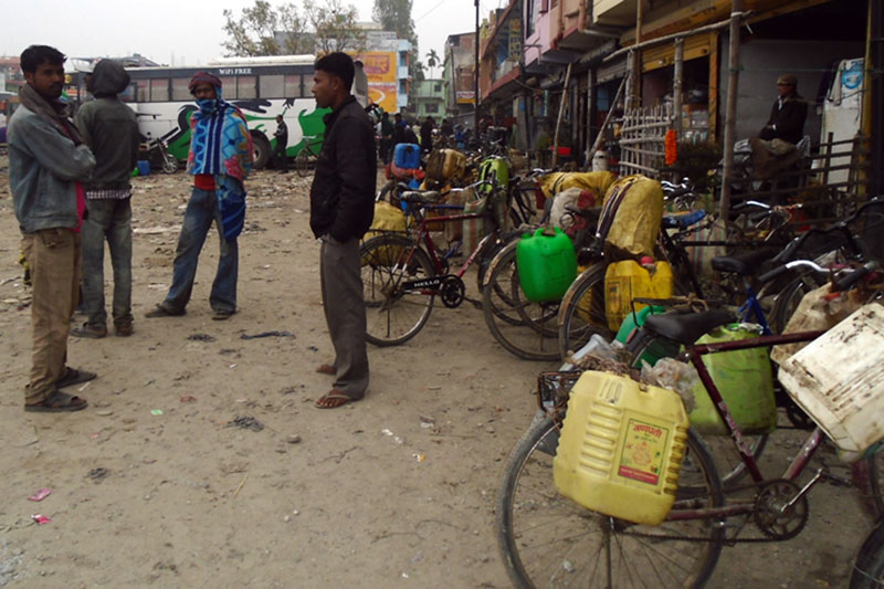 Locals looking forward to selling the petroleum at Biratnagar Buspark after purchasing the petroleum from Kharkatta located in Nepal-India border. Photo: RSS