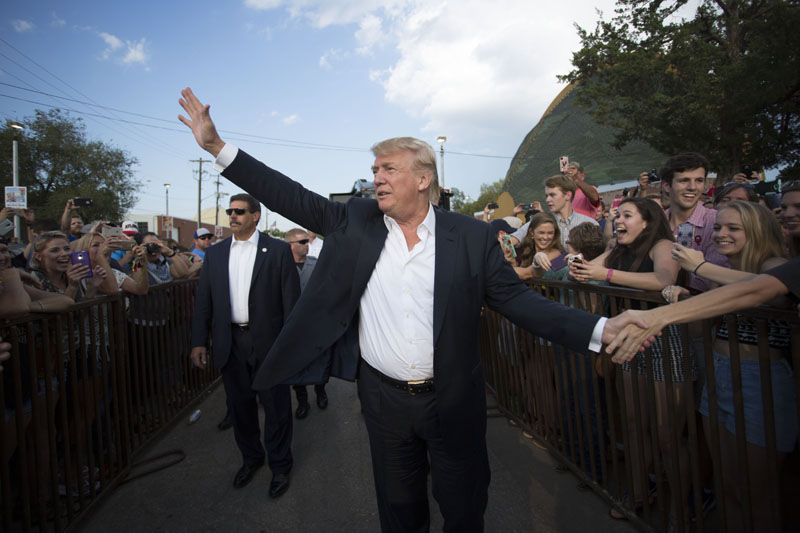 Republican presidential candidate Donald Trump greets supporters before he delivers his message during a campaign rally at the state fair in Oklahoma City on Friday, September 25, 2015. Photo: AP