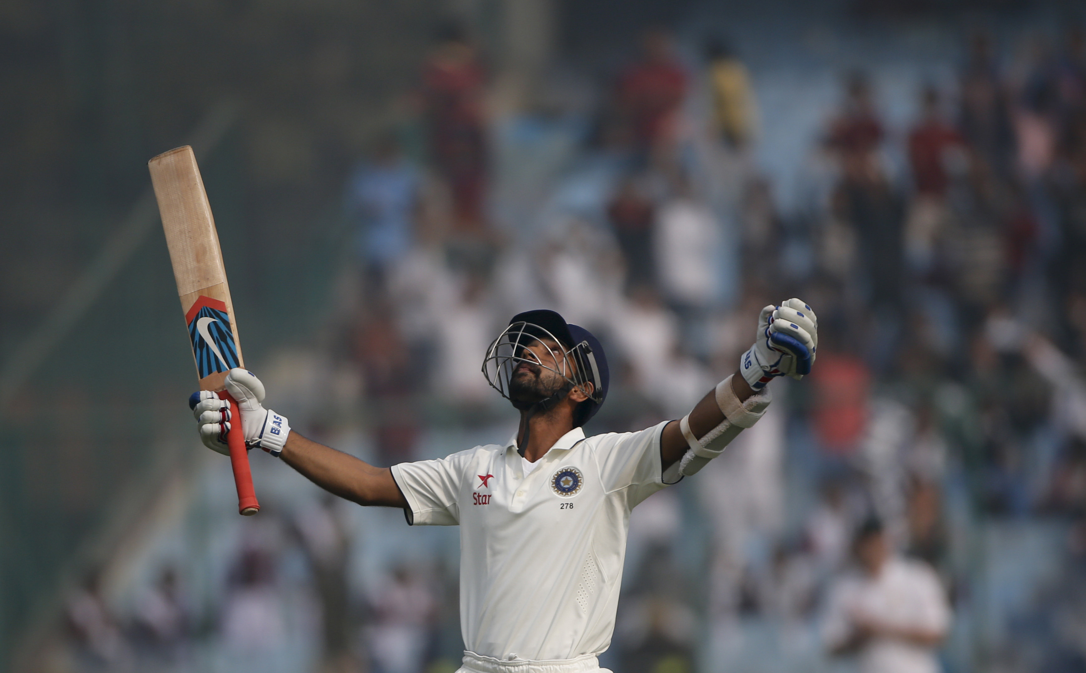 India's Ajinkya Rahane raises his bat after scoring hundred runs against South Africa on day four of their fourth and final test cricket match in New Delhi, India, Sunday, Dec. 6, 2015. Photo: Reuters