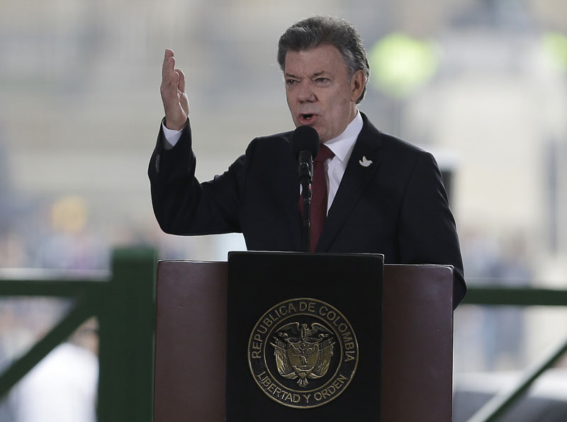Fiile - Colombia's President Juan Manuel Santos speaks at the rebuilt Palace of Justice in Bogota, Colombia On November 6, 2015. Photo: AP